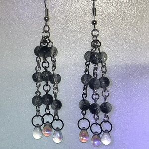 Handmade black and white/grey dangle earrings with clear drop bead detail.